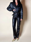 Giacca biker vintage in pelle nera con borchie dorate testa di medusa