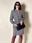 Pochette vintage Yves Saint Laurent in pelle nera con greca logata in rilievo