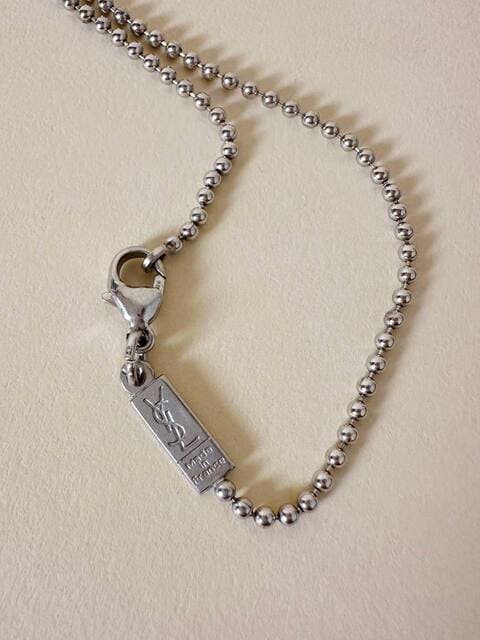 Collier argento con ciondolo a forma di cuore e cristalli incastonati “Yves Saint Laurent”