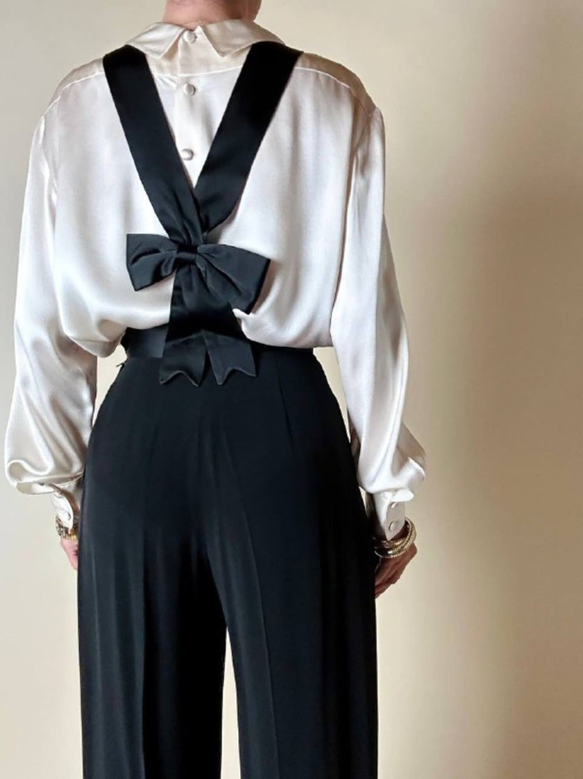 Pantalone nero con bretelle e maxi fiocchi in raso “Moschino Cheap and Chic”