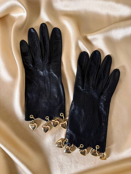 Guanti in pelle nera con charm dorati a forma di cuore “Sermoneta”