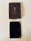 Portafoglio/portatessere anni ‘80 in pelle nera firmato “Yves Saint Laurent”