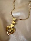 Collana dorata con ciondolo pendente a cuoricini “Yves Saint Laurent”