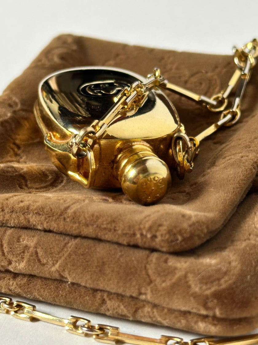 Collana vintage Gucci dorata con piccola bottiglia porta profumo
