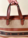 Borsa Yves Saint Laurent in canvas beige con profili color cuoio e motivo greca con logo