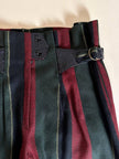 Pantalone a vita alta in lana jacquard a righe verticali con cinturini in pelle nera