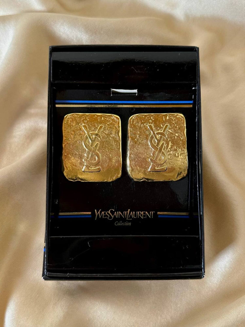 Maxi clip oro con logo “Yves Saint Laurent”