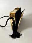 Borsa vintage in velluto nero con struttura dorata e nappe laterali