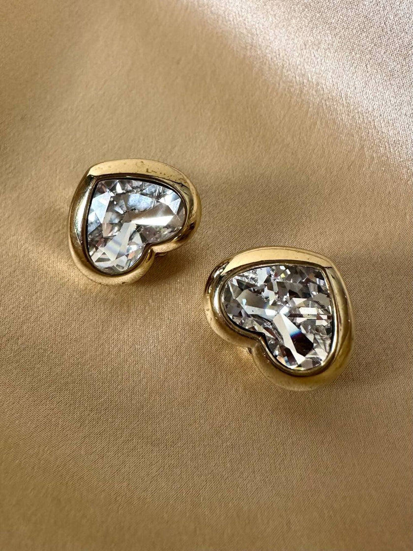 Clip dorate a forma di cuore con strass centrale