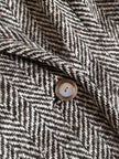 Gilet lungo doppiopetto in tweed a spina di pesce bianco e marrone