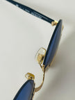 Occhiali da sole vintage Oliver Valentino con montatura gioiello dorata e lenti blu