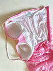 Mini dress rosa in tessuto stretch con micro paillettes trasparenti termo-adesive “La Perla”