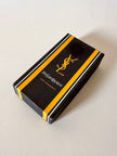 Porte-clés trifold Yves Saint Laurent en cuir noir avec détails dorés et logo YSL embossé