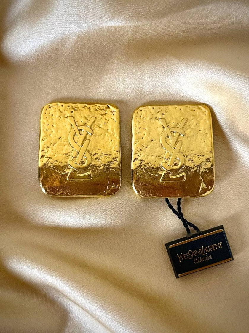 Maxi clip oro con logo “Yves Saint Laurent”