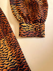 Camicia in pura seta con fiocco al collo e pattern micro rondini 