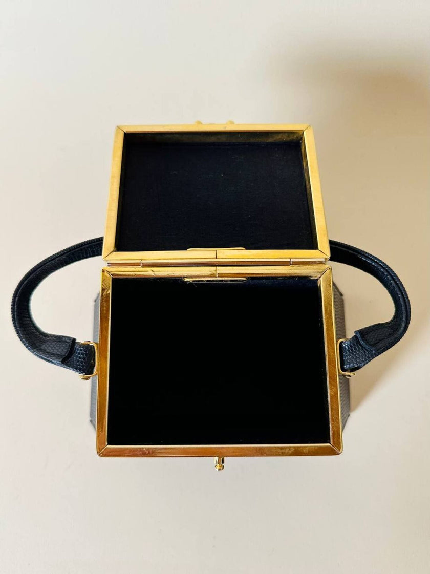 Mini bag a trapezio in ecopelle nera stampa lizard