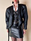 Minigonna a vita alta in pelle nera “Gianni Versace”