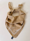 Foulard in seta beige con profili e logo bianchi “Yves Saint Laurent”