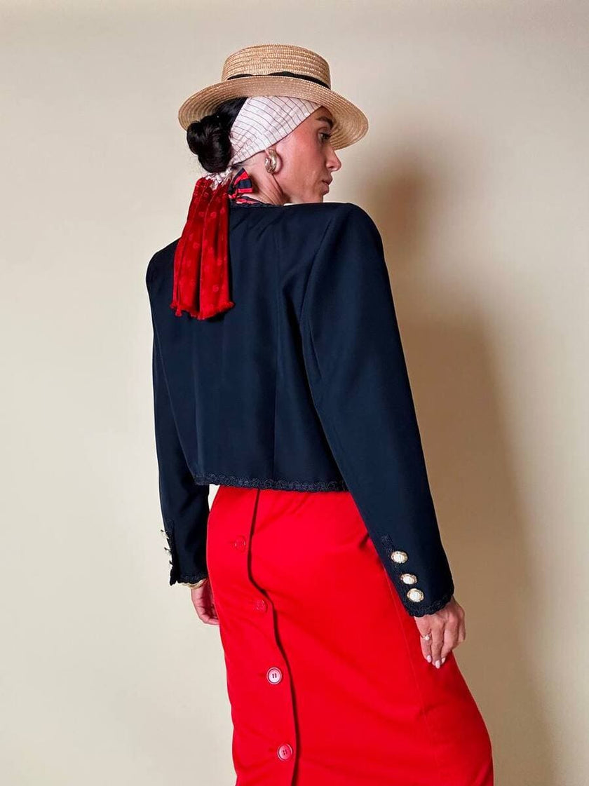 Bolero blu con bottoni gioiello e fiocchi “Max Dinè”