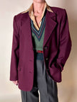 Gilet in lana verde prato con scollo a V e profili a contrasto verde bosco