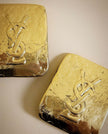 Maxi clip oro con logo “Yves Saint Laurent”