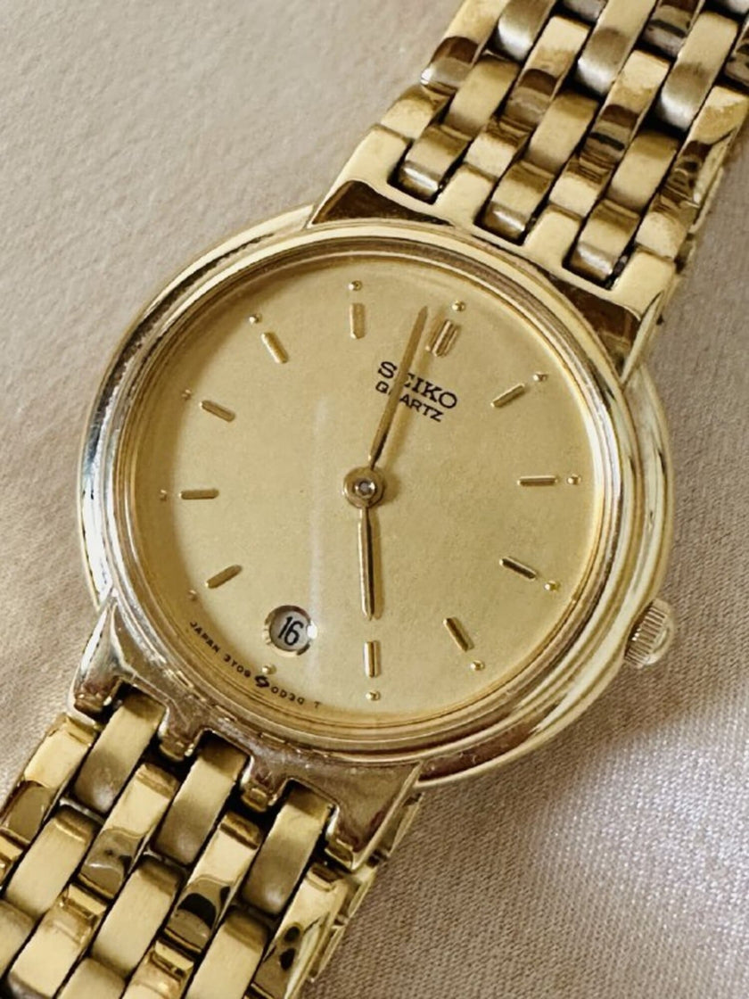 Orologio dorato con cinturino a bracciale “Seiko”