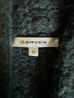 Cardigan Carven in lana verde con manica a tre quarti e cintura in vita