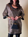Mini bag a trapezio in ecopelle nera stampa lizard