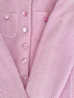 Blazer in lana bouclé rosa con bottoni gioiello logati in madreperla “Yves Saint Laurent”