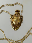 Collana vintage dorata con ciondolo a forma di bottiglia di profumo