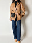 Vintage tan leather jacket with hand-stitched detailing by Claude Collections