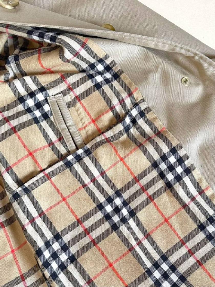 Vintage Burberry’s beige quill gabardine trench coat with matching belt and Check lining