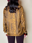 Blusa Yves Saint Laurent in pura seta color topazio con stampa pitone