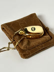 Collana vintage Gucci dorata con piccola bottiglia porta profumo