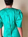 Abito verde smeraldo con abbottonatura posteriore “Yves Saint Laurent”