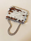 Parure composta da clip e mini bag in paillettes argento