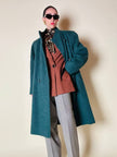 Cappotto doppiopetto in lana bouclé verde bosco con fodera firmata