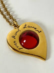 Collier vintage Yves Saint Laurent con ciondolo a forma di cuore firmato e cabochon rosso