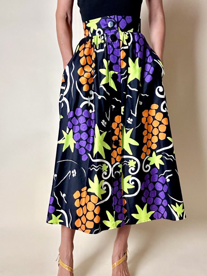Gonna a ruota con abbottonatura frontale e fantasia a grappoli d’uva “Yves Saint Laurent”