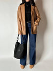 Vintage tan leather jacket with hand-stitched detailing by Claude Collections