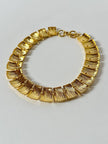 Collier vintage oro con elementi geometrici striati