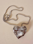 Collier argento con ciondolo a forma di cuore e cristalli incastonati “Yves Saint Laurent”