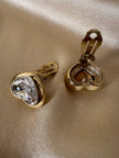 Clip dorate a forma di cuore con strass centrale