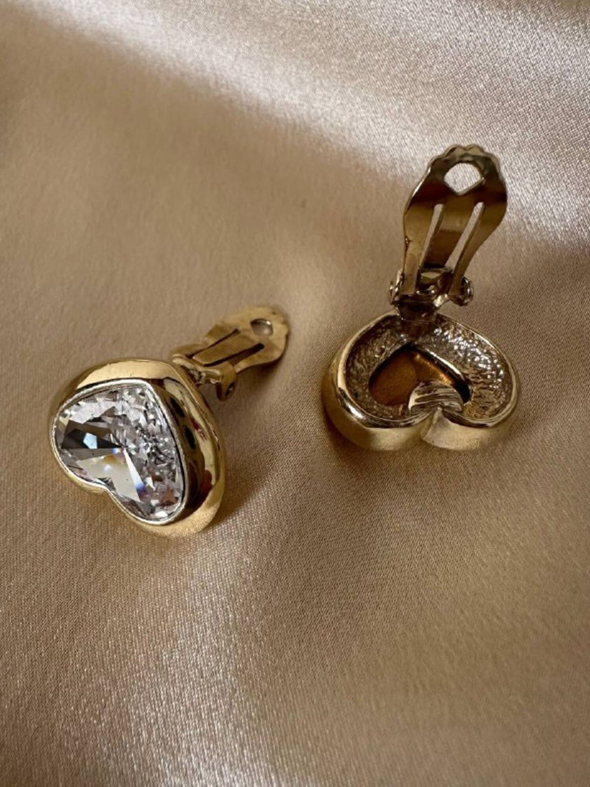 Clip dorate a forma di cuore con strass centrale