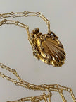 Collana vintage dorata con ciondolo a forma di bottiglia di profumo