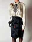 Gonna vintage Yves Saint Laurent Variation in raso nero con bottoni gioiello