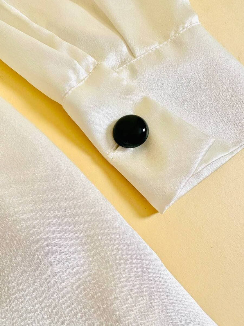 Camicia in raso bianco con fiocco nero “Yves Saint Laurent”