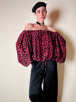Blusa in seta nera con bocche e cuori rossi “Yves Saint Laurent”