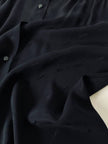 Camicia vintage in seta nera Yves Saint Laurent con logo YSL allover e bottoni in Jet