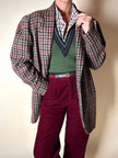 Gilet in lana verde prato con scollo a V e profili a contrasto verde bosco